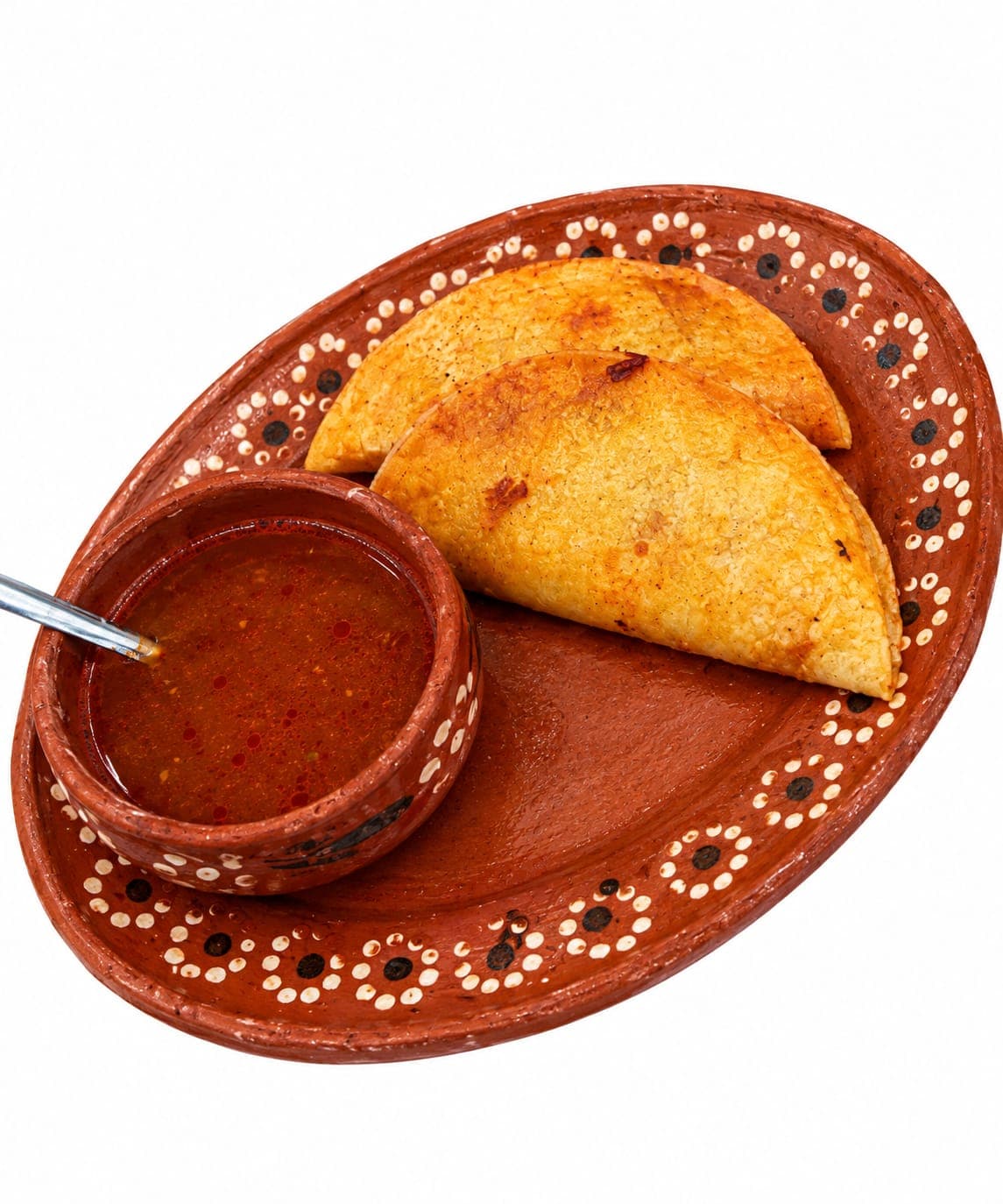 Dos tacos de birria con consomé, parte del kit de inscripción